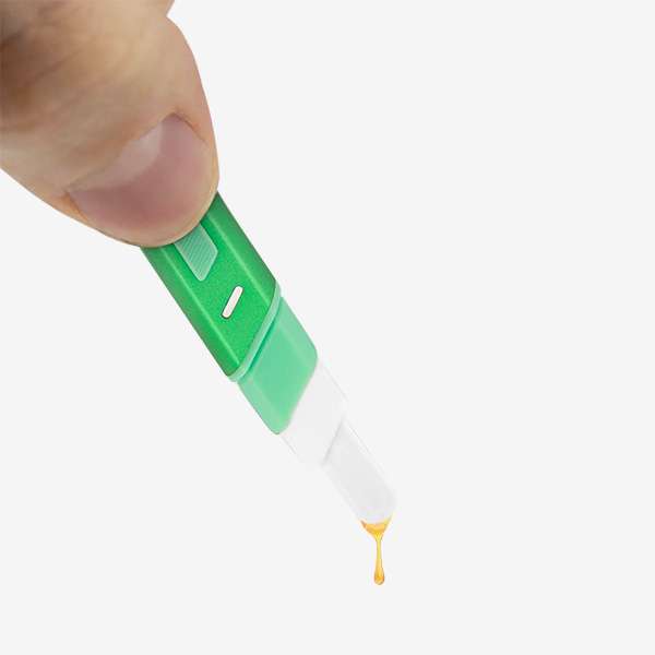 a hand holding a drop of liquid